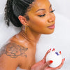 Bathorium Snooze Bath Bomb - model shown holding product
