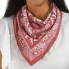 Kasih Co-op Hand Dyed Batik Bandana - Peach Pink Coral Leaves - model shown wearing product around neck