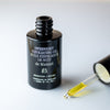 de Mamiel Overnight Exfoliating Oil - product shown next to dropper