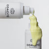 Odacite Edelweiss Extreme™ Hydra-Calm Cream Cleanser - product bottle shown dispensing liquid