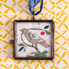 Maris Mirum Small Locket - Cerise Folk Bird - product shown on decorative paper