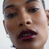 (M)ANASI 7 Tinted Beauty Potion - Cassis - model shown wearing product on face