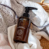 Ruhaku Gettou Reset Cleansing Oil - product shown on top of towels inside basket