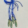 Kiki Co Sardine Charm - four products on included blue cord shown