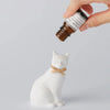 Ballon Cat Oil Diffuser - Small (1 pc) - model shown dripping oil on product