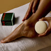 Kate McLeod Foot Stone Solid Foot Moisturizer - model shown using product on foot