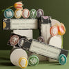 Bridie Hall Grand Tour Collection of Intaglio Soaps - French Grand Antique Marble - multiple products and packaging next to flowers and decorative objects