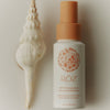 ROZ Air Thickening Spray - Travel - product shown next to seashell 