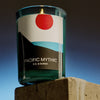 Lifestyle shot of D. S. & Durga Pacific Mythic Candle (7 oz) shown with flame on stone block