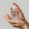 Mother Mother Magnesium Oil + Aloe Roller (1.7 oz) - product shown being held. 