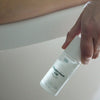 Mother Mother Magnesium Oil + Aloe Roller (1.7 oz) - product shown being held.