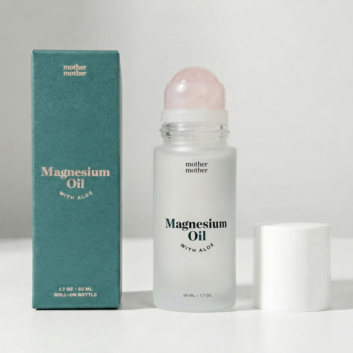 Mother Mother Magnesium Oil + Aloe Roller (1.7 oz) - product shown on grey background. 