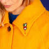 Macon & Lesquoy Hand Embroidered Small Radish Pin (1 pc) shown on lapel of woman's jacket