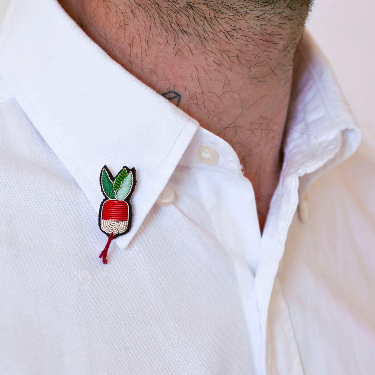 Macon & Lesquoy Hand Embroidered Small Radish Pin (1 pc) shown on lapel of man's dress shirt
