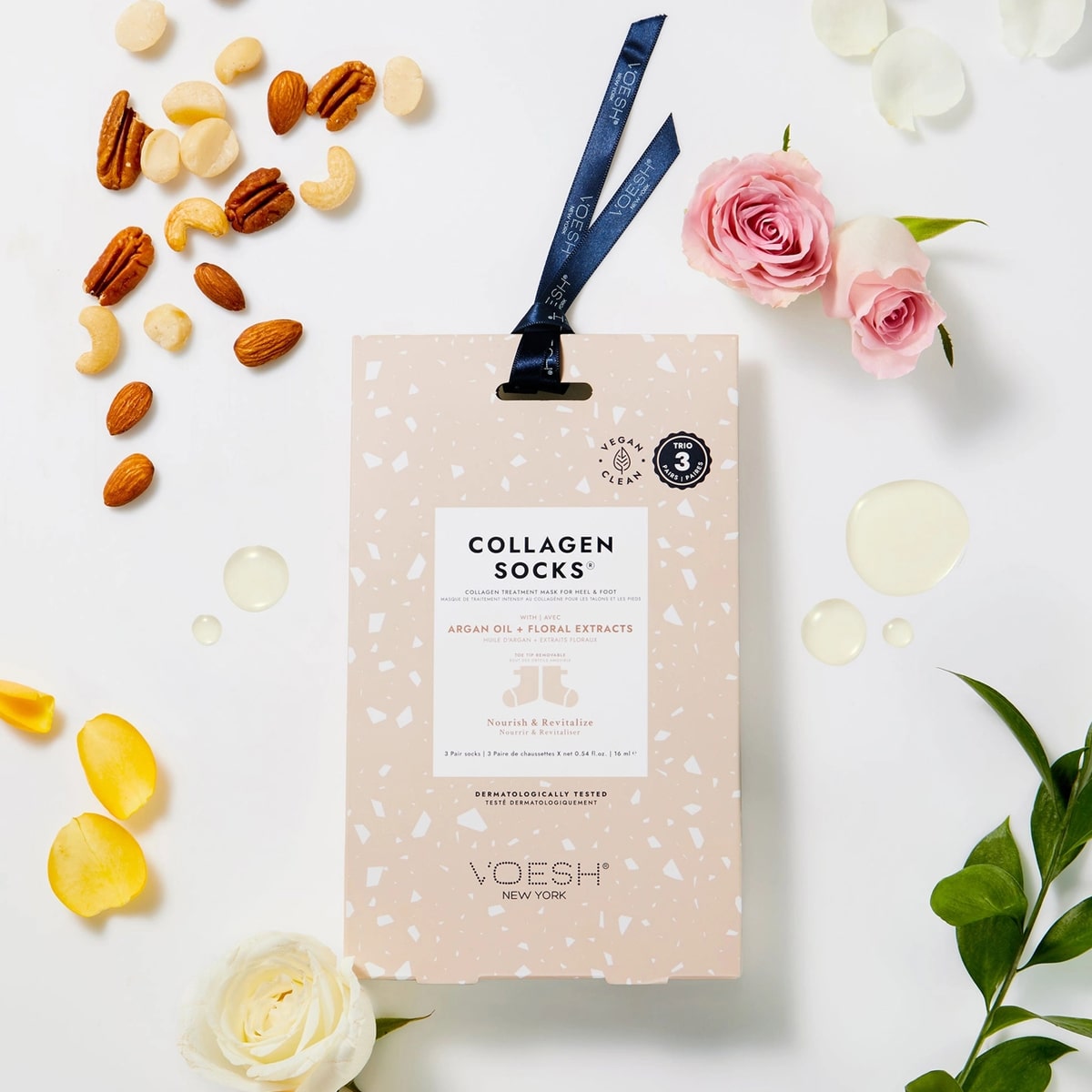 VOESH New York Collagen Socks Trio - Argan Oil & Floral Extracts (3 sets) showing packaging with flowers and nuts on a white background