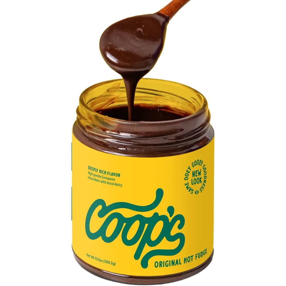 Coop’s Original Hot Fudge (10 oz) with lid off and spoon full of hot fudge