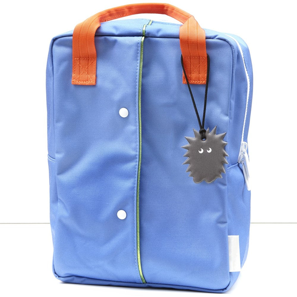 Firefly Reflectors Fuzzy Friend Soft Shape - Charcoal (1 pc) shown on backpack