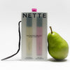 NETTE The Bestsellers Set (2 x 10 ml) with box and a pear and vanilla pod on a white background