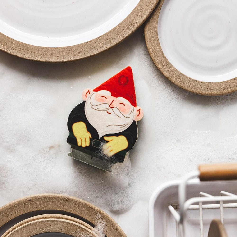 Farmhouse Pottery Gnome Sponge product shown with dishes and bubbles