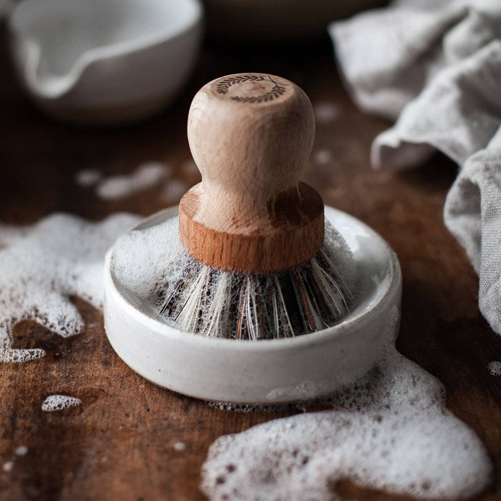 Farmhouse Pottery Laurel Pot Brush Set shown with soap suds