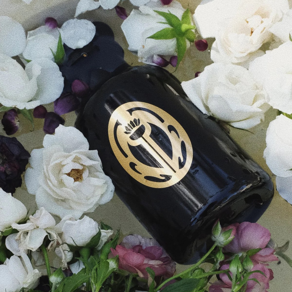 Sangre de Fruta Amphora Vessel - product shown on side with flowers