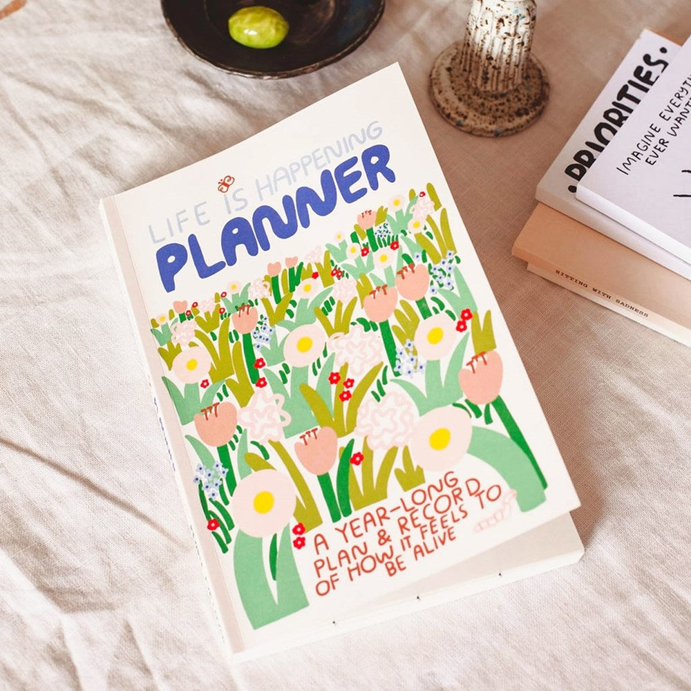 People I’ve Loved Life Is Happening Planner - product shown lying next to books