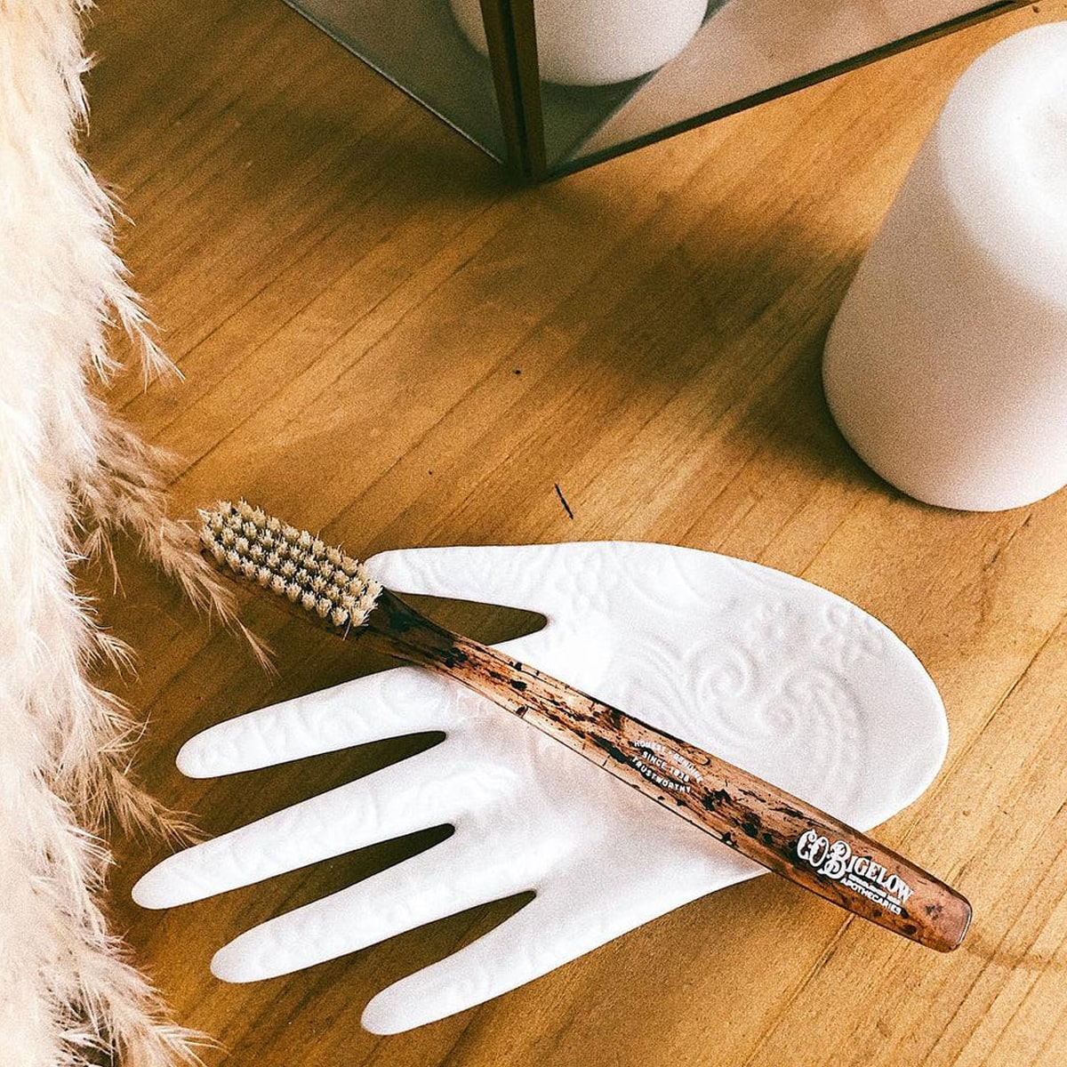 Lifestyle shot of C.O. Bigelow Natural Bristle Toothbrush - Soft Tortoise (1 pc)