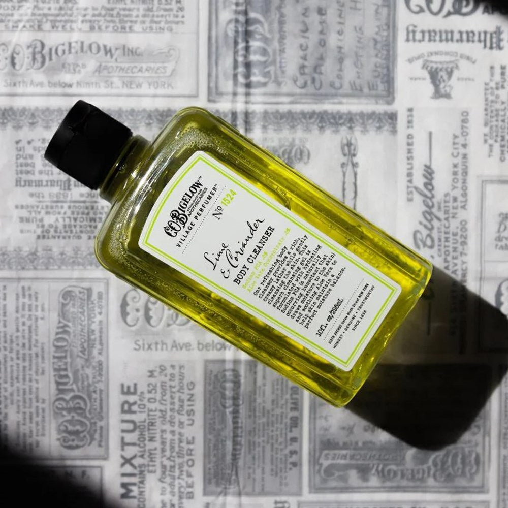 C.O. Bigelow Lime & Coriander Body Cleanser (10 oz) on a newspaper background