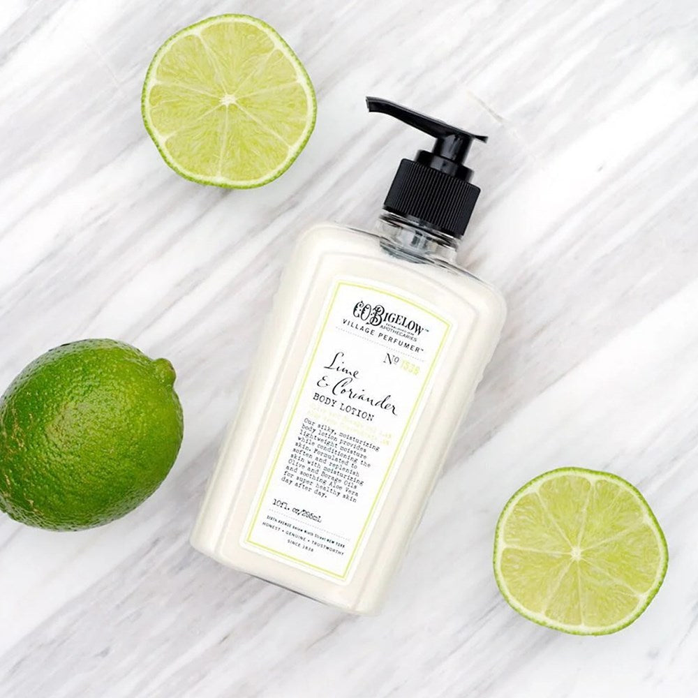 C.O. Bigelow Lime & Coriander Body Lotion (10 oz) with lime slices on a marble background