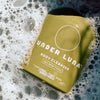 Under Luna Body Cleanser - product front shown with bubbles around bottle