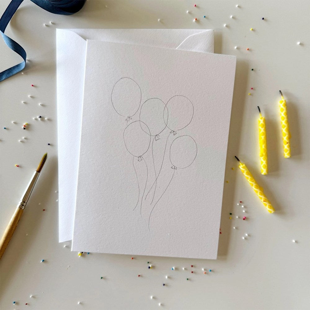 Emily Lex Studio Celebrate Paintable Notecards - front of product shown with paint brush, ribbon and candles