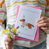 The Charming Press Rabbit Card - front of product shown on envelope with hands and flower