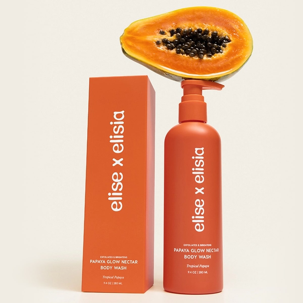 Elise x Elisia Papaya Glow Nectar Body Wash (9.4 oz) with packaging on a white background with a papaya balanced on top of product