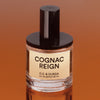 D. S. & Durga Cognac Reign Eau de Parfum (50 ml) - shown on dark orange background