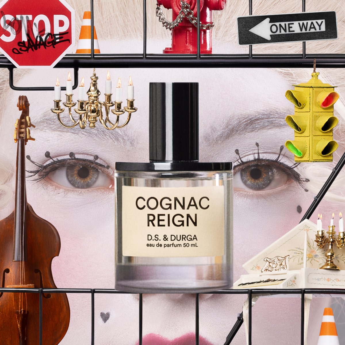 D. S. & Durga Cognac Reign Eau de Parfum (50 ml) - shown on a collage background with eyes in the background, traffic lights, cello, candelabra and other objects.