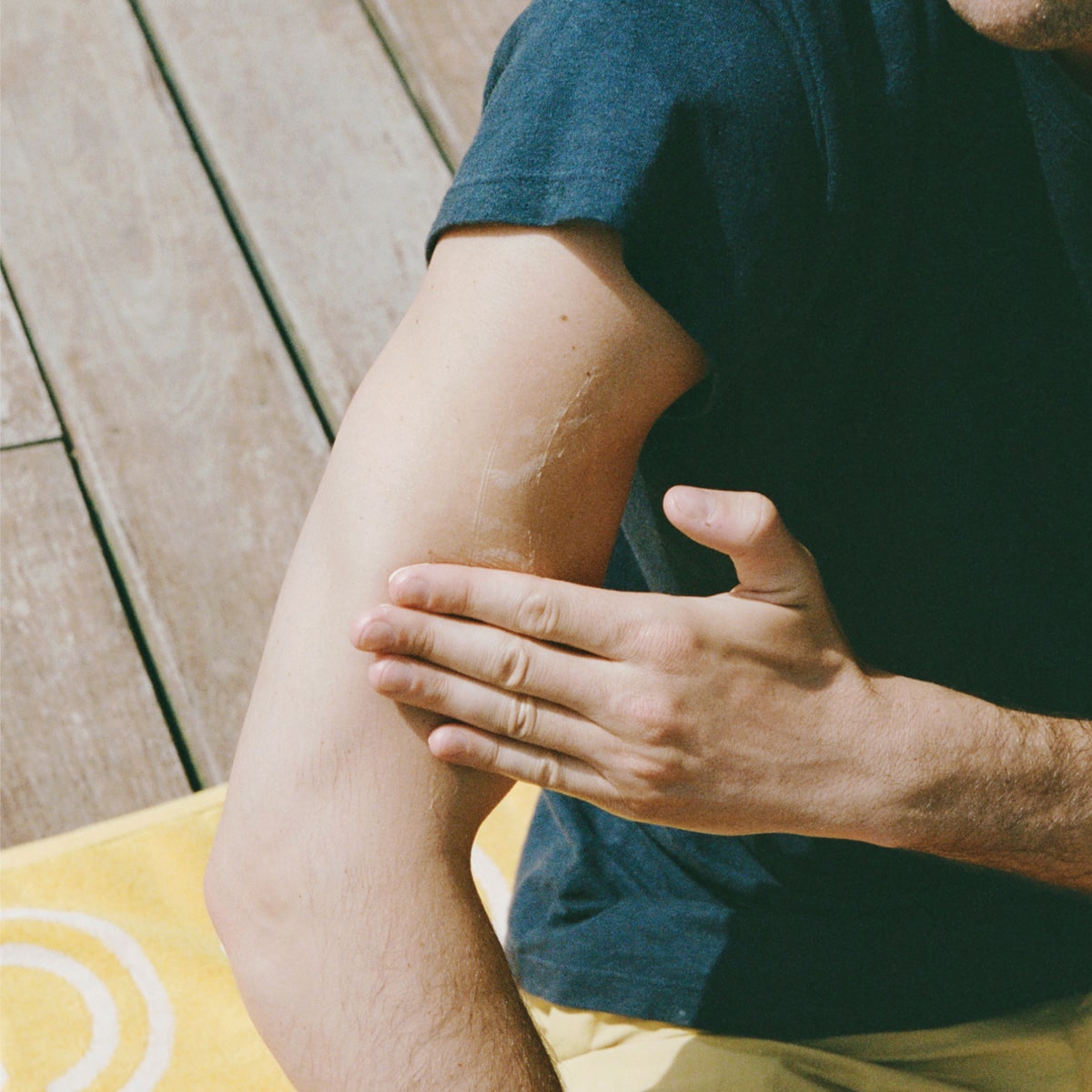 Ursa Major Golden Hour Body Butter (6.7 oz) - person applying product onto arm