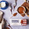 Pierrot Gourmand Milk Caramel Lollipops Box (10 pcs) - packaging shown next to a bowl of caramel and a mug 
