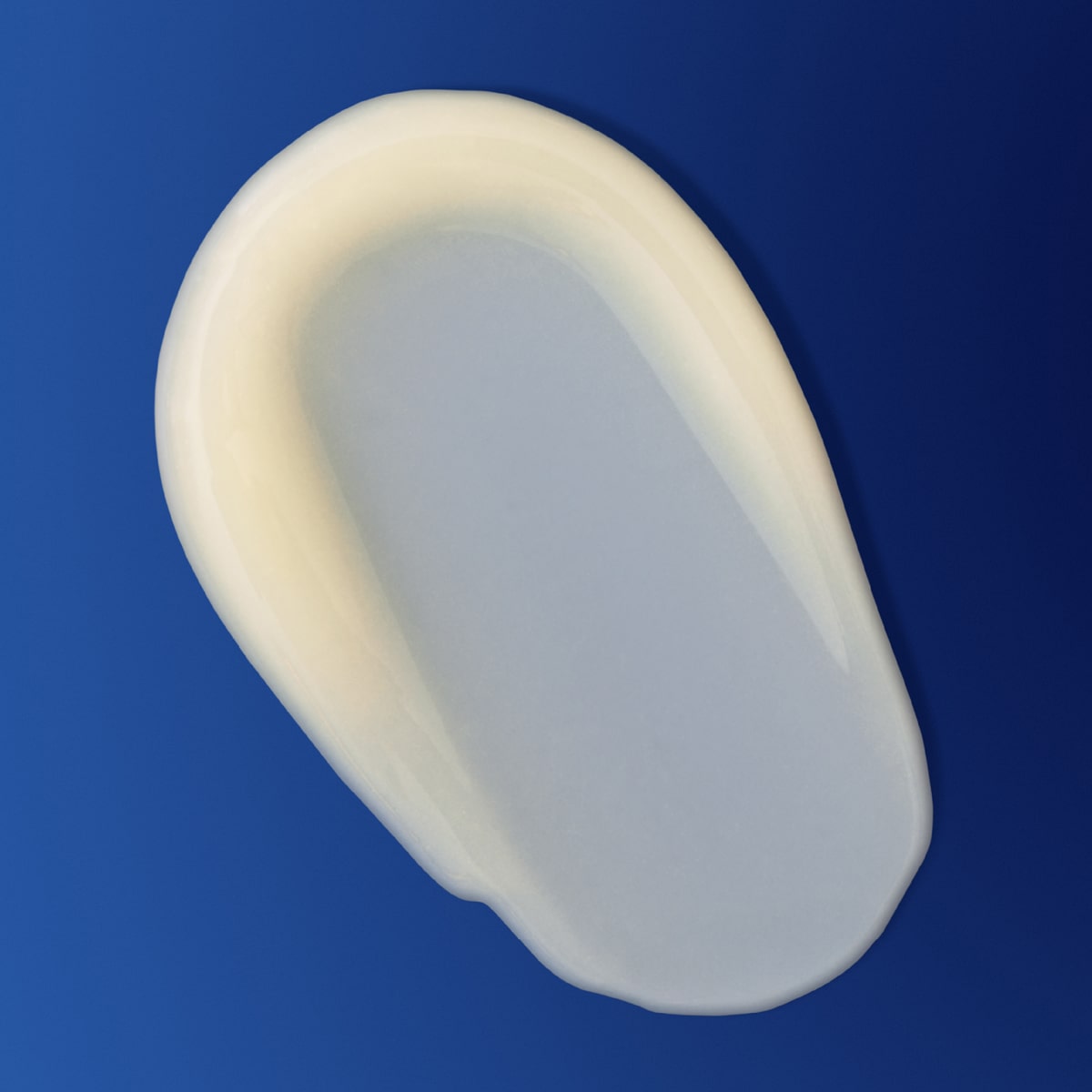 Augustinus Bader The Vitamin C Serum (30 ml) - product smear shown on blue background