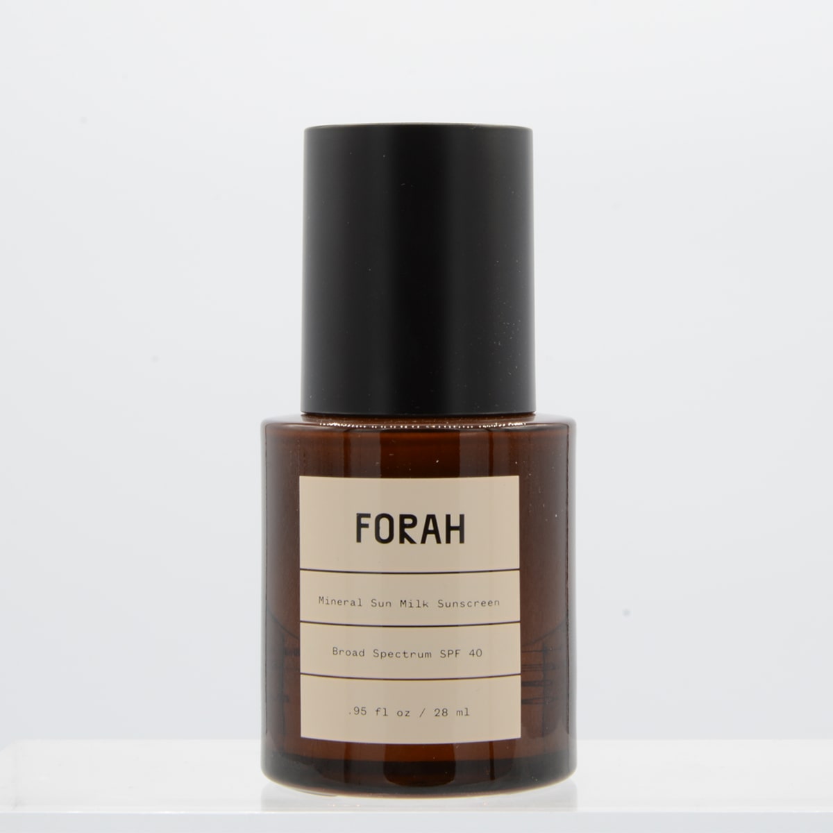 Forah Mineral Sun Milk SPF 40 (.95 oz) - Product with cap on