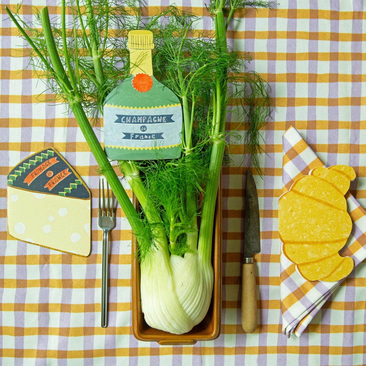 Isatopia French Collection Card Set (6 pc) - product shown on picnic table with plants and cutlery. 