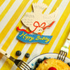 Isatopia Happy Birthday Bird Mini Cards (6 pc) - product shown on yellow table cloth with cutlery shown. 