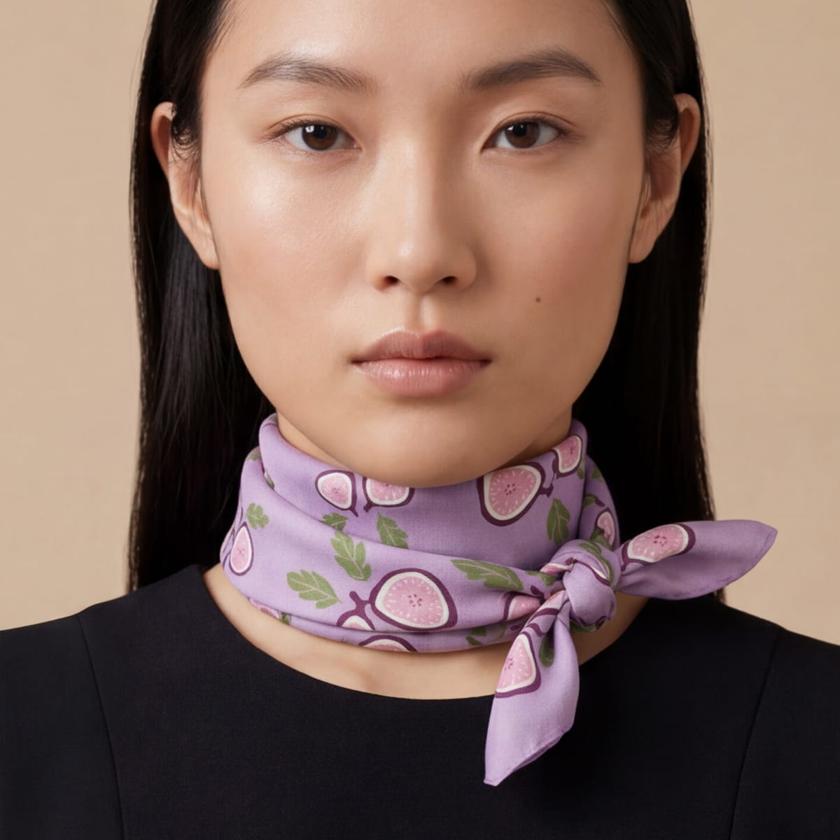 A model wearing a Centinelle Fig Cotton Silk Bandana tied neatly around her neck