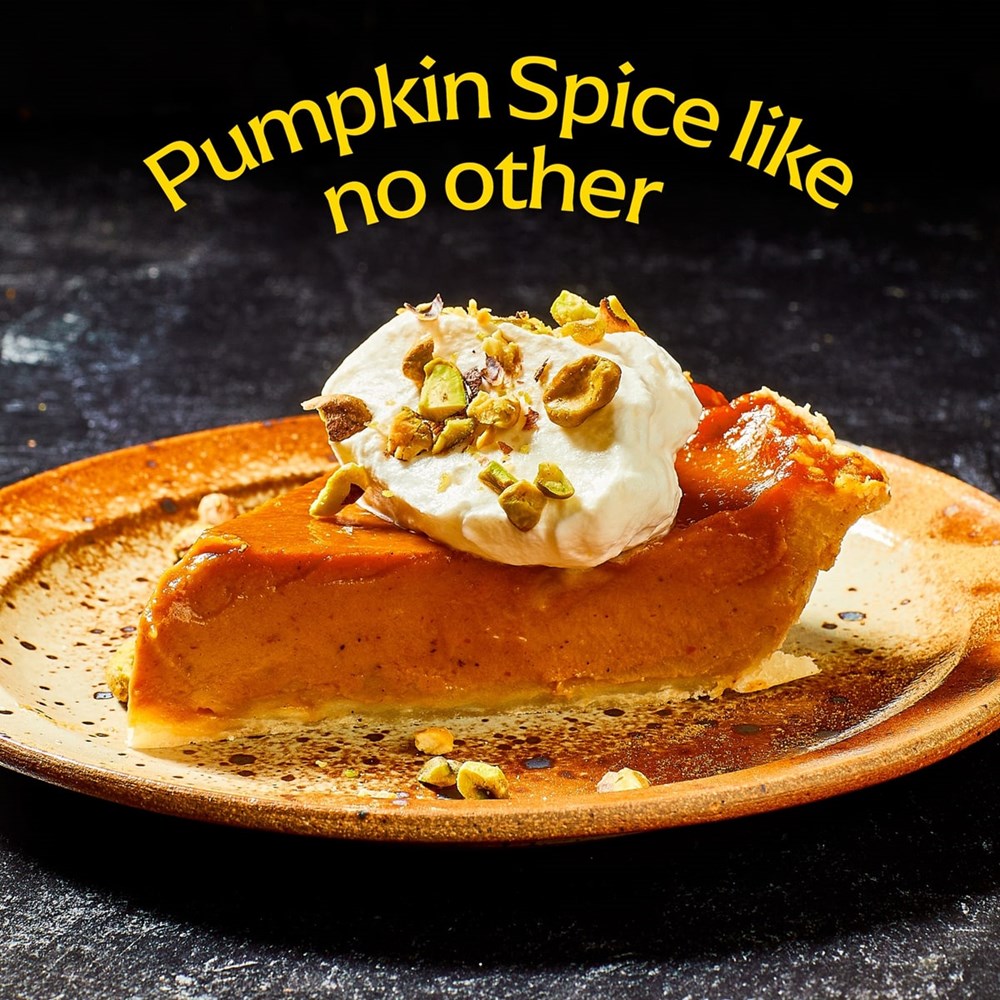 Diaspora Co Pumpkin Spice (1.4 oz)  - slice of pie with whipped cream and nuts shown