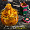 Diaspora Co Nik's Achari Masala (1.9 oz) - product shown open with a spoon in the jar next to a jar of pickles with a fork