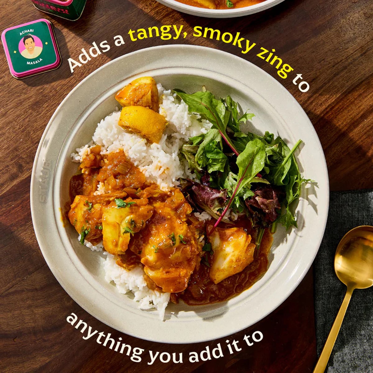 Diaspora Co Nik's Achari Masala (1.9 oz) - plate of food and spoon shown next to lid of product jar