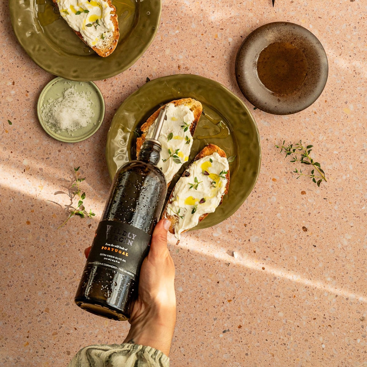 Wildly Virgin Joaquim’s Reserve Olive Oil (16.9 oz) & Pour Spout (1 pc) - Products being used on toast. 