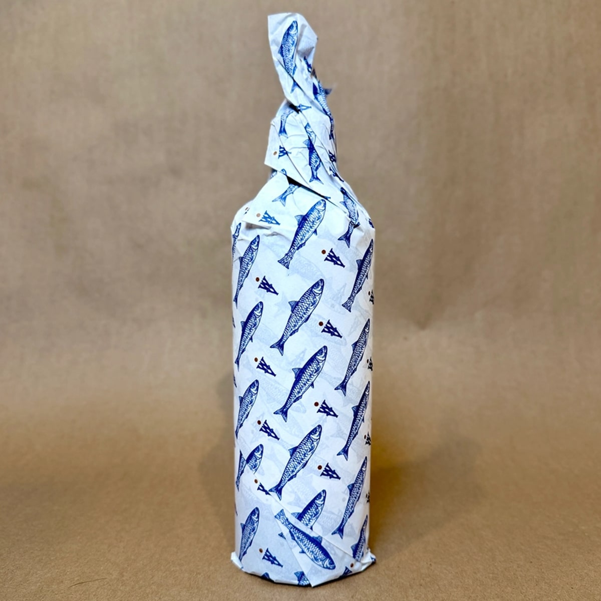 Wildly Virgin Joaquim’s Reserve Olive Oil (16.9 oz) & Pour Spout (1 pc) - Product shown wrapped in blue and white paper.
