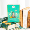 La Sablesienne Pastry Cat Langues Box (160 g) - product shown next to books with cookies on a book with ribbon