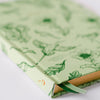 Good Juju Ink Green Botanical Bird Toile Journal (1 pc) - Satin bookmarks highlighted with white background. 