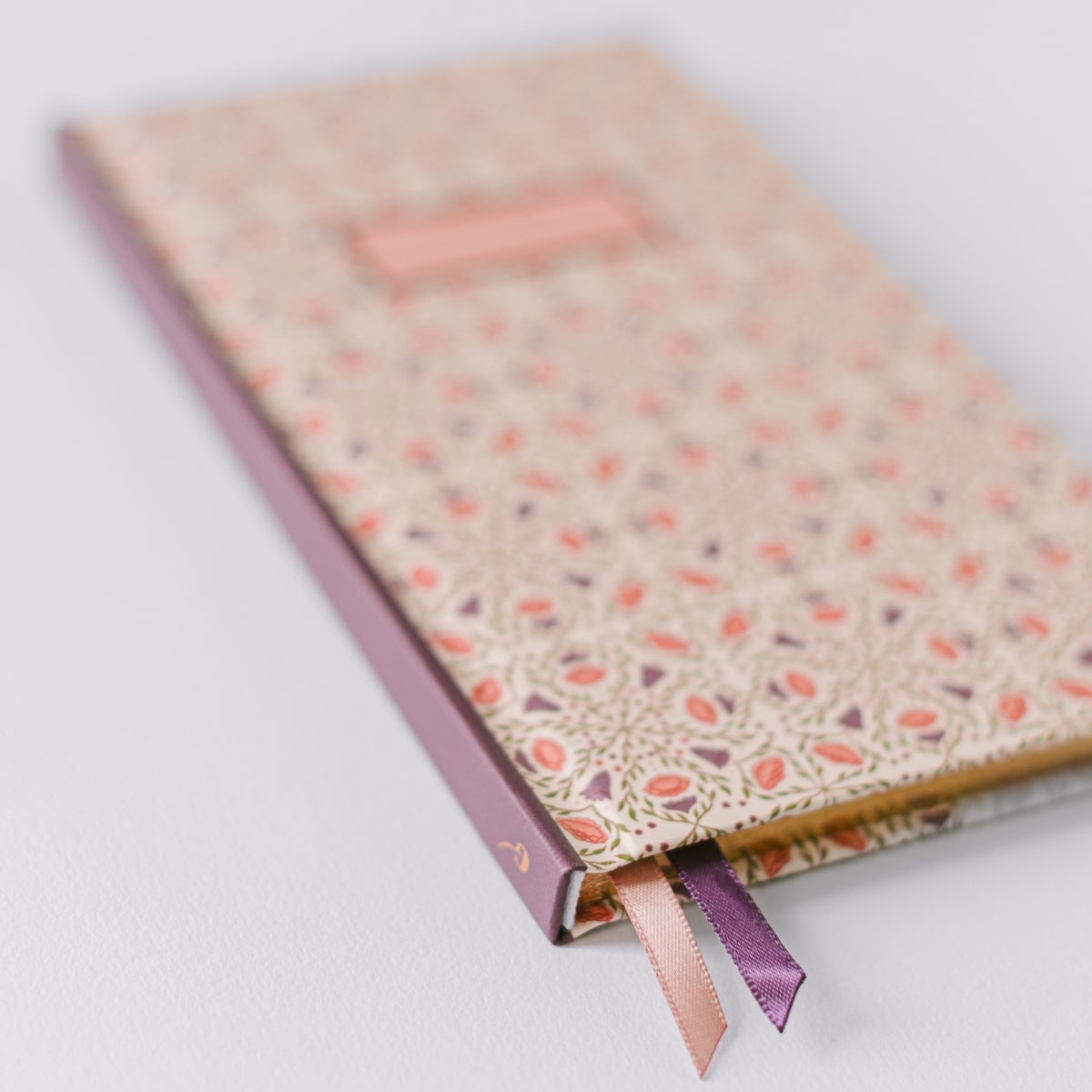Good Juju Ink Ivory Folk Pattern Pocket Journal (1 pc) - Satin bookmarks highlighted on white background. 